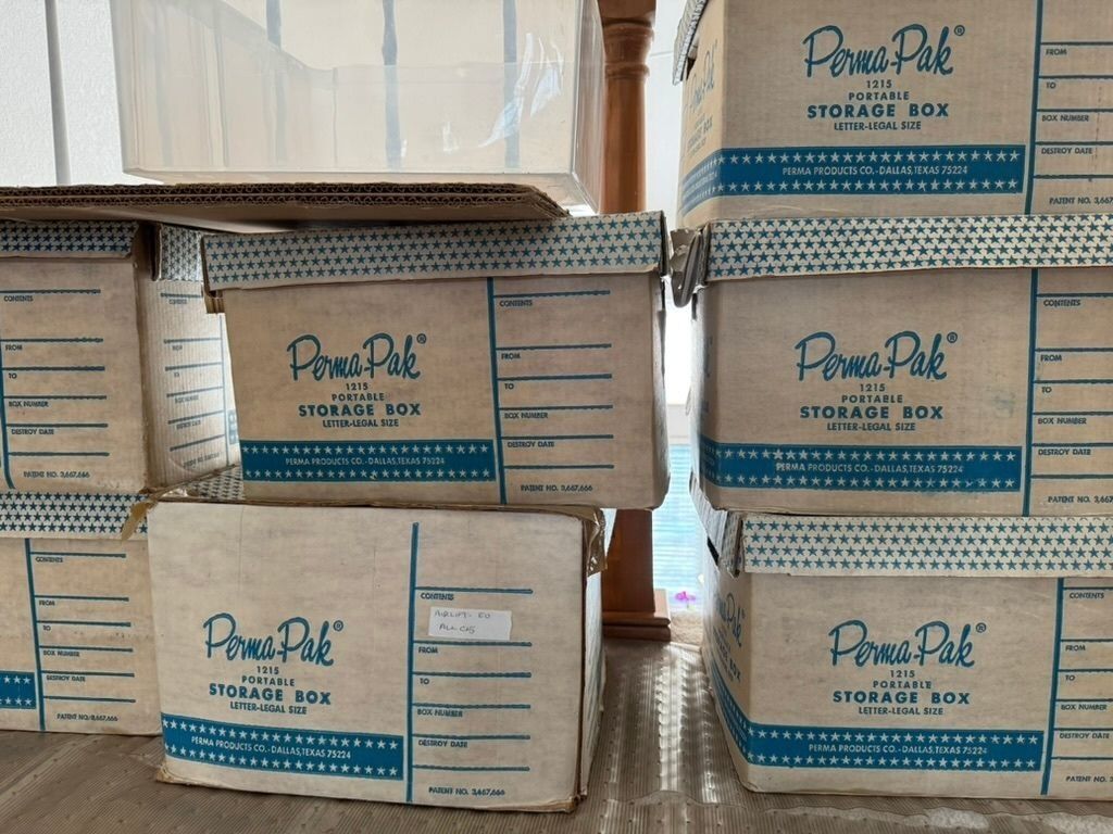 Original Perma-Pak storage boxes holding the Friends For All Children records.